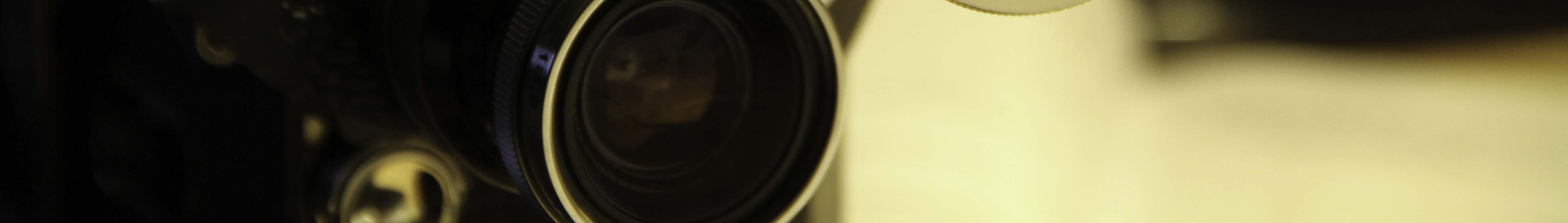 Image of close-up of a vintage camera lens focusing on the intricate details of its glass and metal construction. this high-resolution image captures the nostalgia of classic photography equipment. ideal for enthusiasts of analog cameras and retro aesthetics.