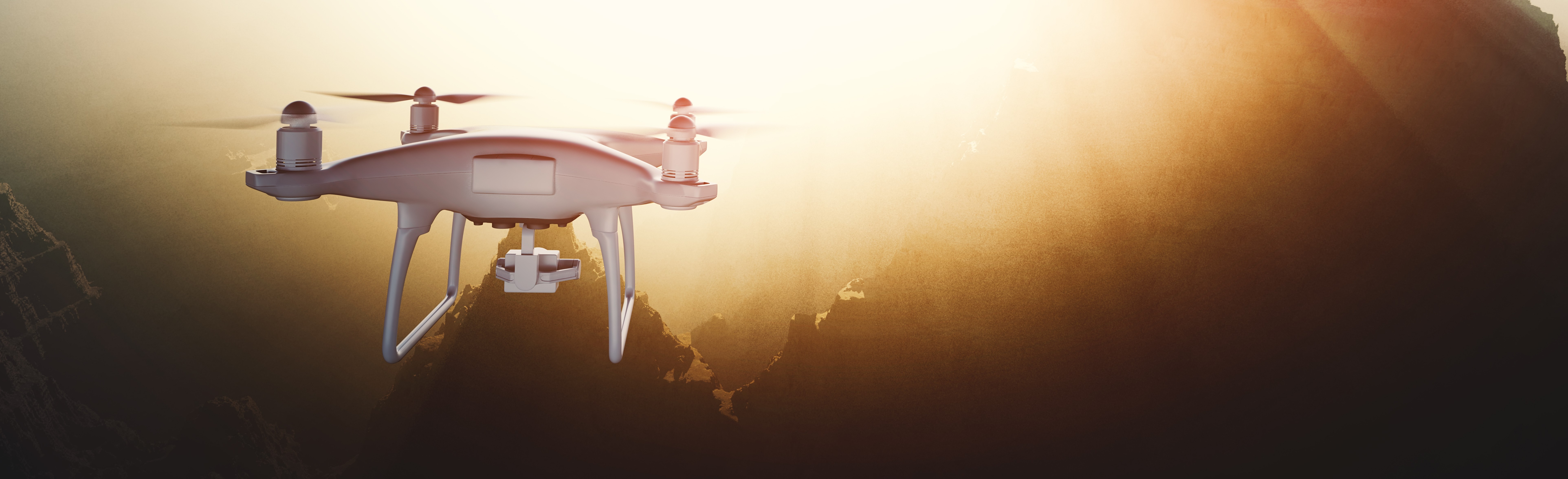 Image of a drone hovering over a scenic canyon at sunset, capturing breathtaking aerial views. the golden light enhances the landscape's dramatic cliffs and deep gorges. perfect for showcasing drone photography and nature exploration. keywords: drone, canyon, sunset, aerial photography, nature