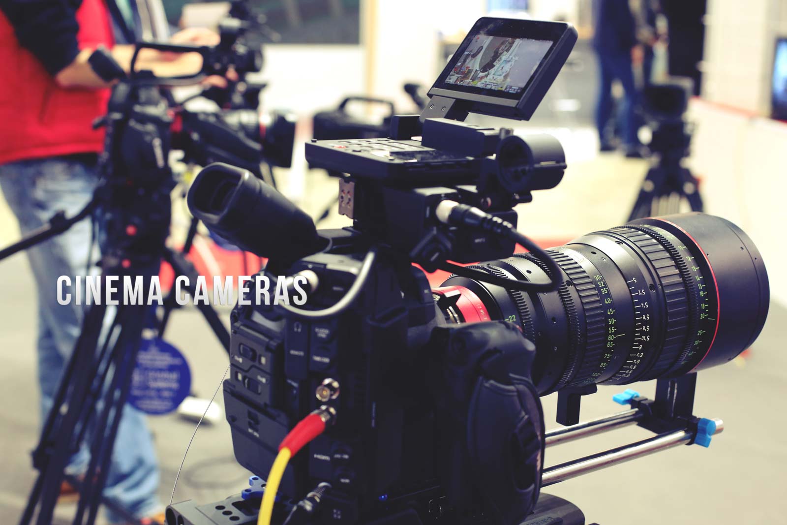 Image of this image showcases a professional film production setup, highlighting advanced cinema cameras equipped with large lenses and mounted on tripods. the scene is likely set in a studio or filming location, illustrating the high-end video equipment used in movie making, cinematography, and