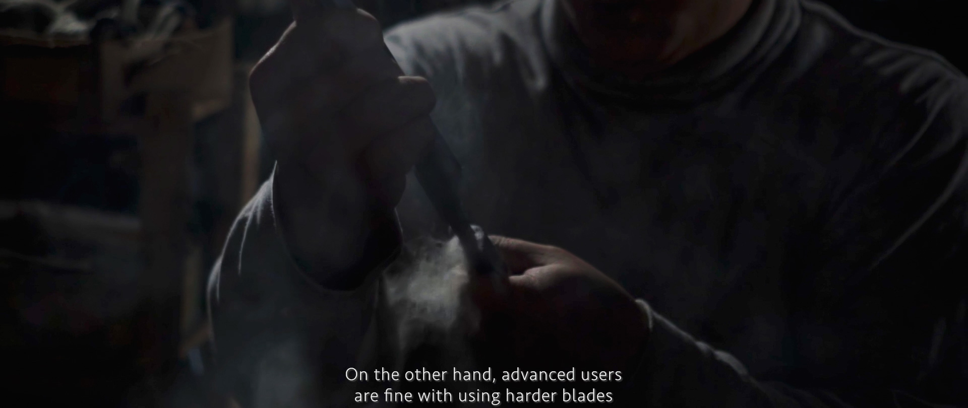 Image of a craftsman intently working with a tool in a dimly-lit workshop, emphasizing hands-on expertise and precision. the image highlights the intricate art of woodworking or metalworking, showcasing advanced skills and tools like harder blades. ideal for users seeking insights into