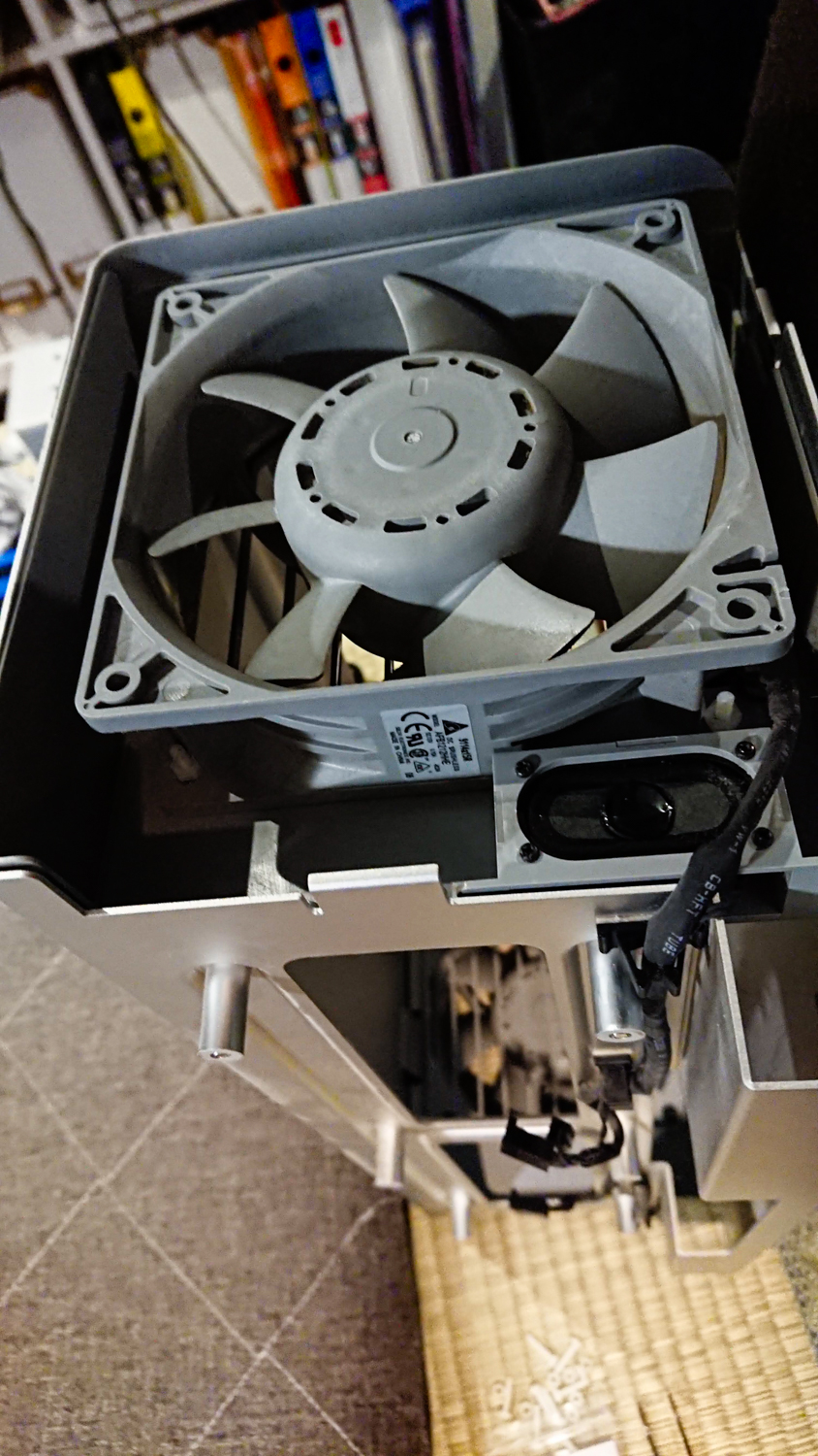 Image of this image showcases a close-up of a computer's cooling fan system, highlighting intricate hardware components typically found inside a desktop pc. the setup features a gray fan within a metal casing, emphasizing computer maintenance and internal tech design. ideal for keywords like "pc